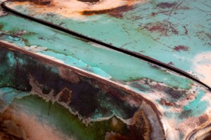 Image of the surface of a rusty blue car for the blog How Corrosion Protection Coatings Stop Metal From Rusting